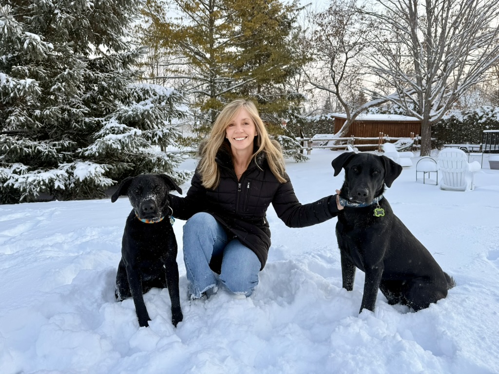 Lisa Needham with her two black Labrador retrievers